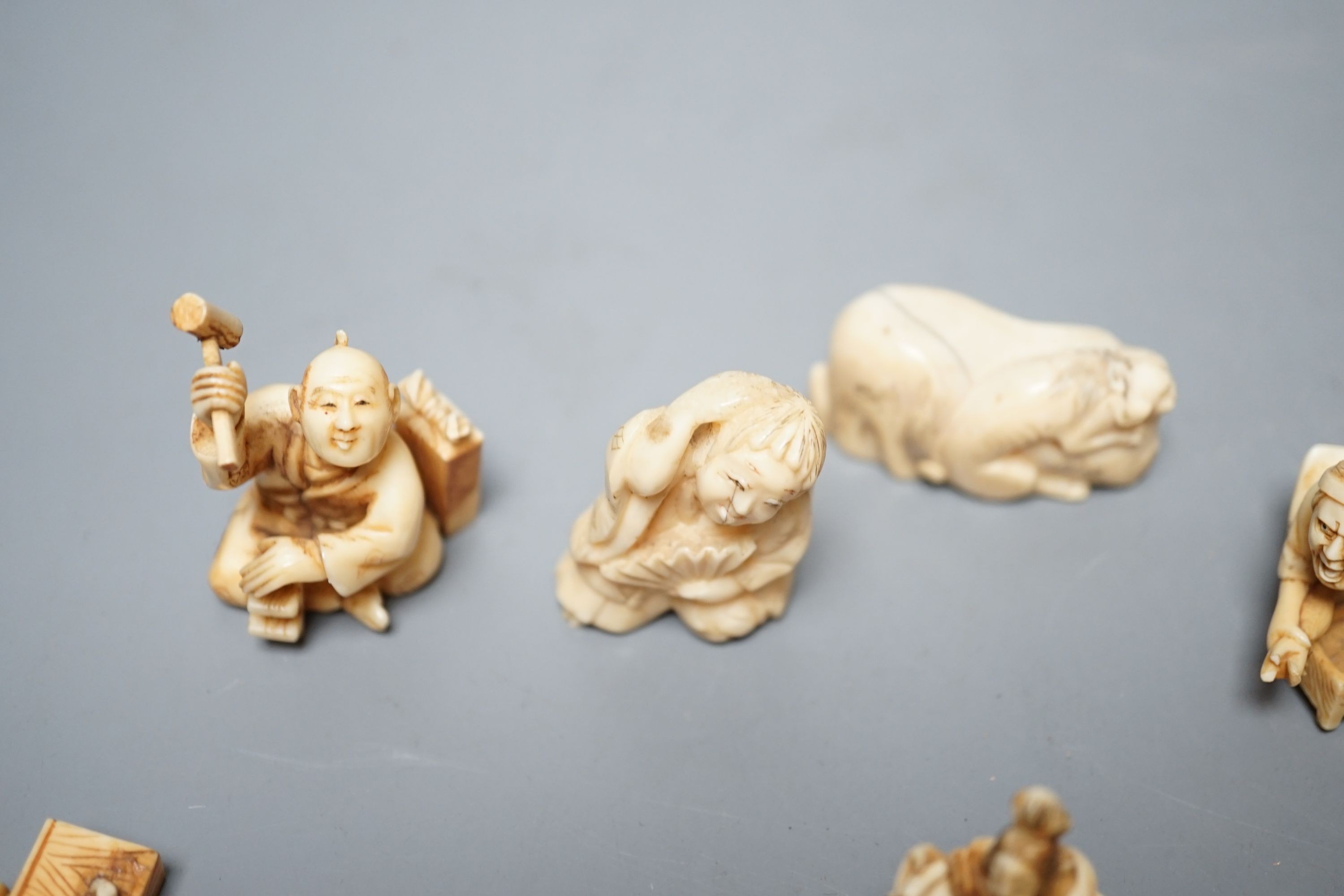A collection of eight Japanese Ivory and bone Netsuke and okimono, 19th/early 20th century